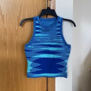 Blue, sweater crop top. Longer than a usual crop top so can be worn as a top.